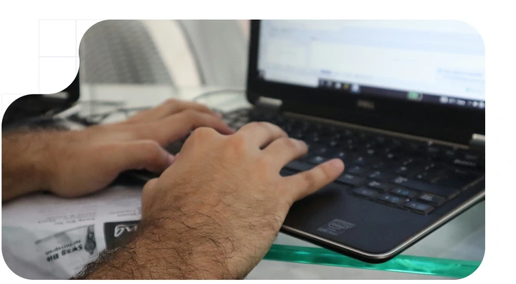 cybercriminal creating a phishing email scam, a criminal offense under 6AMLD