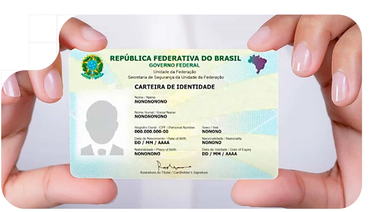 Person holding their Brazilian ID in accordance with KYC regulations