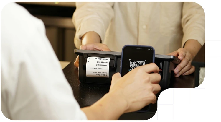 Client scanning the QR code in their invoice with their phone