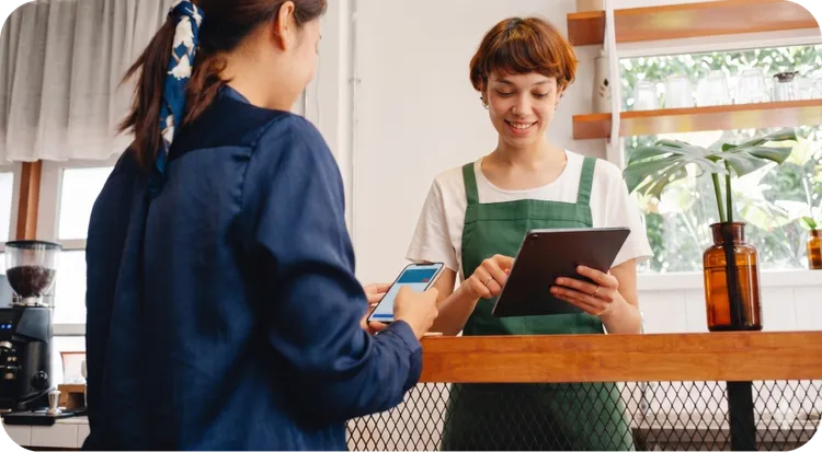 Girl showing a QR code to be scanned